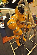 The Newtsuit is an atmospheric diving suit which has fully articulated rotary joints in the arms and legs.