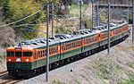 A 6-car train of Shonan-colored S51 + S52 trains as an express "Shinshu" on the Shinano Railway in April 2013.