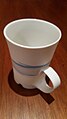 Porcelain mug by Margaret Brown, Australian, white with blue second colouring