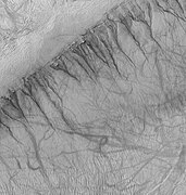 Gullies on one wall of Kaiser Crater. Gullies usually are found in only one wall of a crater.