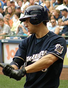 A baseball player in navy