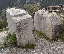 Two stone slabs standing upright.