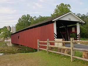 The traditional colors of a Lancaster County covered bridge: red sides and white portals
