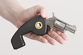 North American Arms (NAA) mini revolver in .22 LR. It can fold into its own grip for safe belt clip carry.