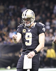 Drew Brees in a New Orleans Saints jersey and helmet.