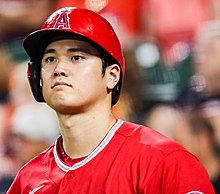 Ohtani looking off in the distance, wearing a batting helmet