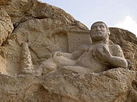 Hellenistic-era depiction of the Zoroastrian divinity Bahram as Hercules carved in 153 BCE at Kermanshah, Iran.
