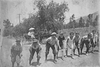 First Congregational Church of Sierra Madre Sunday foot race of Church boys in 1890 on Central Ave (Sierra Madre Blvd). Looking west, the camera is in front of the Old North Church.