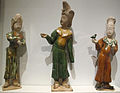 Sancai figures wearing fanlingpao (kuapao-style), overlaps on the right and closes to the right, Tang dynasty.