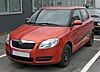 A red Škoda Fabia II car.