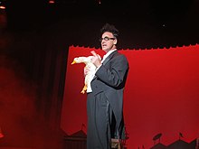 Ed Alonzo holding Bob the Duck while performing at Kings Island