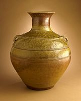A hu jar from China, probably Zhejiang Province, late Western Han dynasty or early Eastern Han dynasty, about 100 B.C.-A.D. 100, Proto-Yue ware, wheel-thrown stoneware with applied and incised decoration and green glaze, Los Angeles County Museum of Art