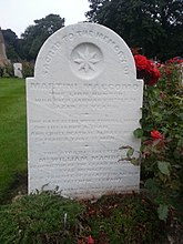 Photograph of white stone grave