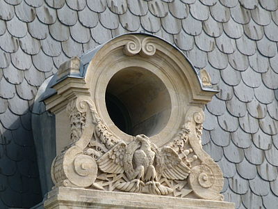 Baroque Revival volutes of a dormer window (oeil-de-boeuf type) on the building of préfecture de police de Paris, Île de la Cité, by Victor Calliat, mid-19th century