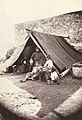 Homeless survivors of the earthquake in Messina, in 1908, under a tent.