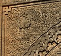 Arabesque motifs and a palmette image carved into the spandrel of the Marinid gate at Chellah, Rabat