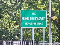 Sign bearing the official name of the span