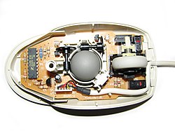Logitech mechanical mouse with top cover removed.
