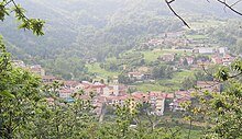 Photograph of the village and surrounding hills