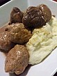 Mix of ragoût de boulettes and ragoût de pattes de cochon with mashed potatoes.
