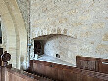 Hagioscope / squint in St. John the Baptist church at Symondsbury, Dorset.