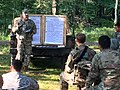 1-337th BSB Observer/Controller-Trainer conducts an After-action review to assist a Reserve unit capture lessons learned from their exercise