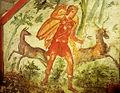The goddess Diana hunting in the forest with a bow, and wearing the high-laced open "Hellenistic shoe-boots" associated with deities, and some images of very high status Romans. From a fresco in the Via Livenza Hypogeum, Rome, c. 350 AD