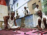 A-1. (Street game) A street-corner game of pachisi in Pushkar, Rajasthan.