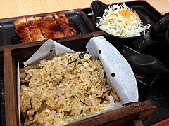 Okowa bento-styled meal served in a restaurant. Steamed glutinous rice with teriyaki chicken and cabbage