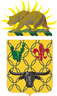 Shield: Or, chain mail Vert, in chief a prickly pear cactus of the last and a fleur-de-lis Gules and in base a carabao affronté Sable. Crest: That for the regiments and separate battalions of the California Army National Guard: On a wreath of the colors Or and Vert, the setting sun behind a grizzly bear passant on a grassy field all Proper.