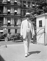 Charles Evans Hughes with the EEOB in the background