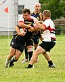 Paul "Cujo" Canjar laying the smackdown on a Michigan RFC player