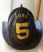 Leather and steel firefighting helmet