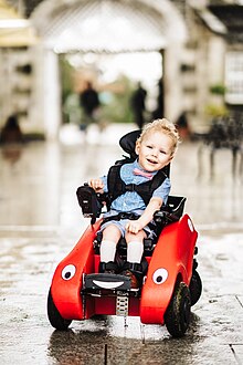 young disabled child using a Wizzybug powered wheelchair