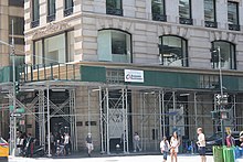 Detail of the Knox Building's ground-floor storefront at Fifth Avenue and 40th Street, which is surrounded by scaffolding and contains full-height windows