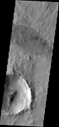 A. Dark slope streaks are the tiny, linear albedo features along the SE wall of the crater. Compare with the far larger, wind-related albedo feature (oval patch at center top of image). This image is a THEMIS VIS from the Mars Odyssey spacecraft. It is about 25 km wide. North is at top.