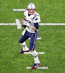 Brady stepping back to pass