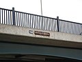 Closeup of bridge parapet showing name Tom Rolt Bridge