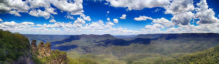 View of Jamison Valley from north escarpment, outside Katoomba: Three Sisters far left; Mount Solitary left of centre; Narrowneck Plateau, far right