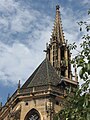 Detail of couloured tiled roof and of spire