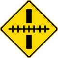 Railway crossing ahead at a right angle