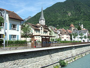 Shelter on street-side platform next to river