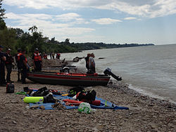 Lake Erie shoreline with Coast Guard personnel