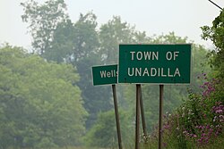 A sign for the town of Unadilla, New York, on New York State Route 7.
