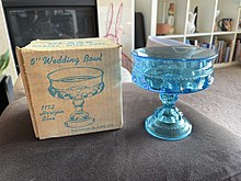 turquoise glass bowl with box next to it that says 5 inch wedding bowl, 1172 horizon blue, with smaller print saying Indiana Glass Co., subsidiary of Lancaster Colony Corporation, Dunkirk, Indiana