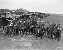 The officers of No. 85 Squadron, including Major Mannock, in front of their Royal Aircraft Factory S.E.5a scouts at St Omer aerodrome, 21 June 1918