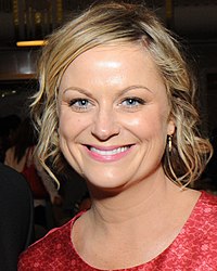 Cropped picture showing the actress posing on the red carpet wearing a black dress