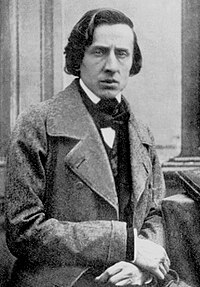 Chopin faces the viewer, wearing an overcoat