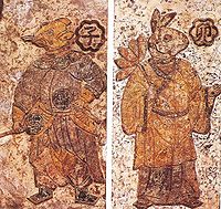 Paintings on ceramic tile from the Chinese Han Dynasty (202 BC – 220 AD); these figures, cloaked in Han Chinese robes, represent guardian spirits of certain divisions of day and night. On the left is the guardian of midnight (from 11 pm to 1 am) and on the right is the guardian of morning (from 5 to 7 am). From the National Museums of Scotland, Edinburgh.
