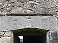 Portal with a coat of arms[13]